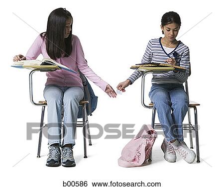 Two girls copying in an examination View Large Photo Image Stock Photograph - Two girls copying in an examination. Fotosearch