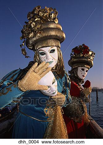 Picture - Two people dressed in masquerade costumes. Fotosearch