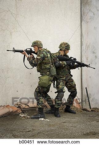 Two soldiers aiming their rifles View Large Photo Image Stock Image - Two soldiers aiming their rifles. Fotosearch