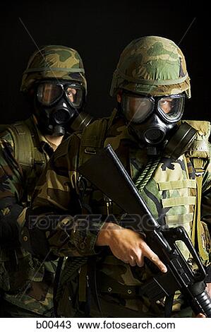 Two soldiers wearing gas masks and holding rifles View Large Photo Image Stock Image - Two soldiers wearing gas masks and holding rifles. Fotosearch