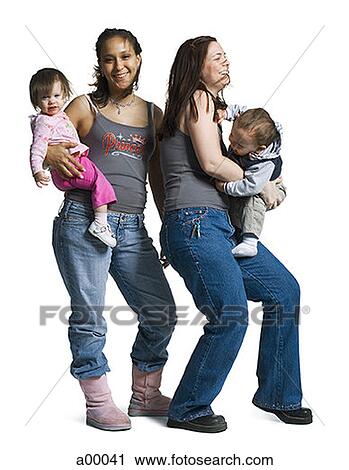 Two young women carrying their children View Large Photo Image Stock Image - Two young women carrying their children. Fotosearch