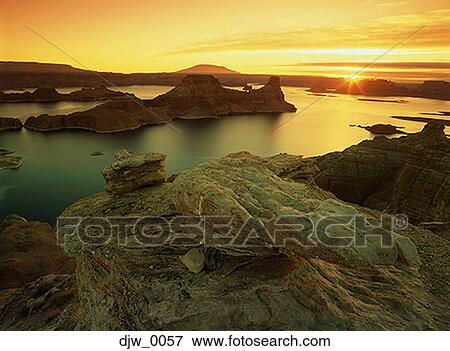 View of a sunset over water View Large Photo Image Stock Photo - View of a sunset over water. Fotosearch