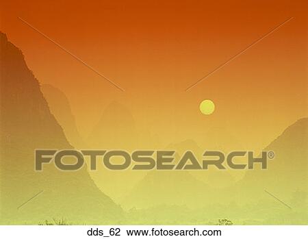 Stock Image - View of mountains at dusk. Fotosearch