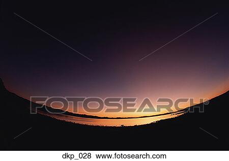 Wide angle view of a sunset View Large Photo Image Stock Photo - Wide angle view of a sunset. Fotosearch