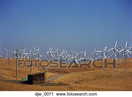 Stock Image - Wind turbines in a field. Fotosearch