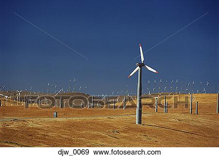 Wind turbines in a field View Large Photo Image Stock Photo - Wind turbines in a field. Fotosearch