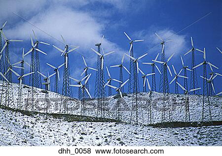 Stock Photo - Windmills on a snow covered hill. Fotosearch