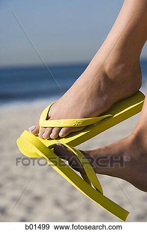 flip flops on feet