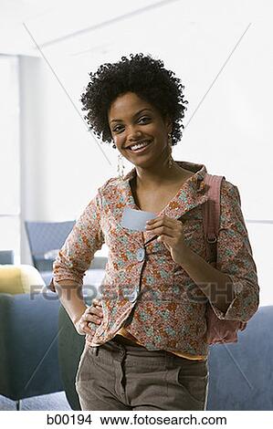 Young black woman at home, drinking coffee View Large Photo Image Picture - Young black woman at home, drinking coffee. Fotosearch