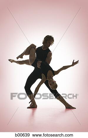 Young male ballet dancer supporting female ballerina View Large Photo Image Stock Photo - Young male ballet dancer supporting female ballerina. Fotosearch