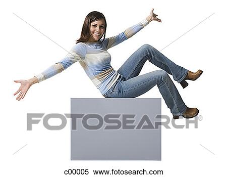 Young man holding a blank sign in front of his face View Large Photo Image Stock Photography - Young man holding a blank sign in front of his face. Fotosearch