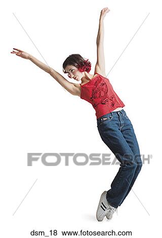 Young woman dancing with her arms raised View Large Photo Image Stock Photo - Young woman dancing with her arms raised. Fotosearch