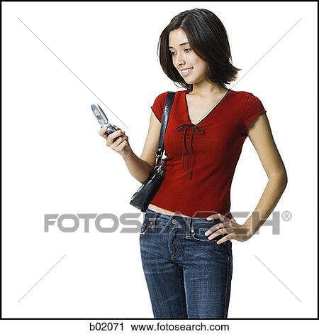 Young woman holding a mobile phone View Large Photo Image Stock Image - Young woman holding a mobile phone. Fotosearch