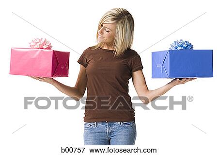 Young woman holding gifts View Large Photo Image Stock Photo - Young woman holding gifts. Fotosearch