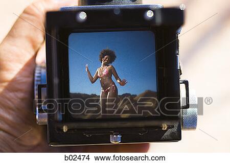 Young woman on a camera View Large Photo Image Picture - Young woman on a camera. Fotosearch
