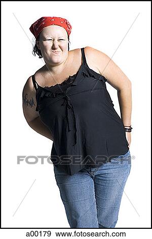 Young woman standing and squinting her eyes View Large Photo Image Stock Photo - Young woman standing and squinting her eyes. Fotosearch