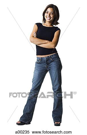 Stock Photography - Young woman standing with her arms crossed. Fotosearch