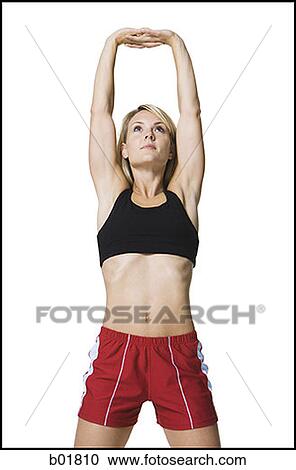 Young woman stretching her arms View Large Photo Image Stock Image - Young woman stretching her arms. Fotosearch