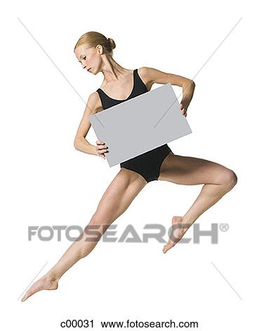Young woman stretching her leg with a blank sign View Large Photo Image Stock Image - Young woman stretching her leg with a blank sign. Fotosearch