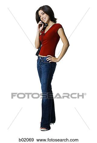 Young woman talking on a mobile phone View Large Photo Image Stock Photo - Young woman talking on a mobile phone. Fotosearch
