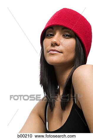 Stock Image - Young woman with a red hat. Fotosearch