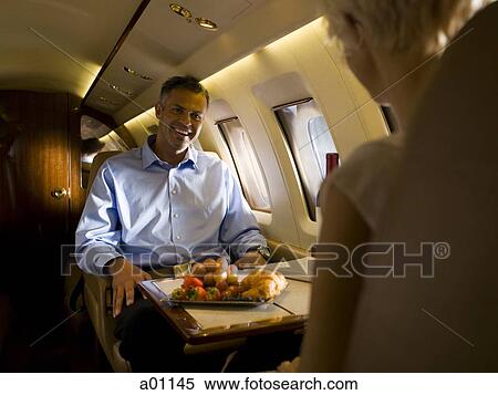 Stock Photography - A couple in an airplane. Fotosearch
