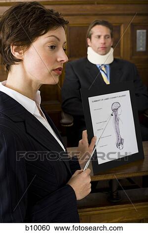 A female lawyer pointing at evidence in front of a victim in a courtroom View Large Photo Image Stock Image - A female lawyer pointing at evidence in front of a victim in a courtroom. Fotosearch