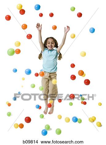 A girl smiling and playing with colored balls View Large Photo Image Picture - A girl smiling and playing with colored balls. Fotosearch