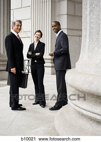 A Portrait of three lawyers in front of a courthouse View Large Photo Image Stock Image - A Portrait of three lawyers in front of a courthouse. Fotosearch