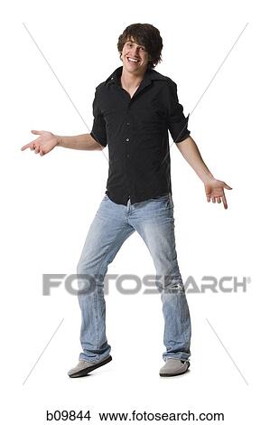 Picture - A teenage boy smiling and shrugging. Fotosearch