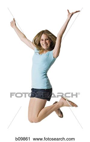 Stock Image - A teenage girl jumping. Fotosearch