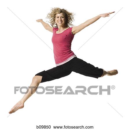 A young woman jumping View Large Photo Image Stock Image - A young woman jumping. Fotosearch