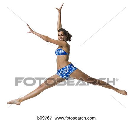 A young woman jumping View Large Photo Image Stock Photo - A young woman jumping. Fotosearch