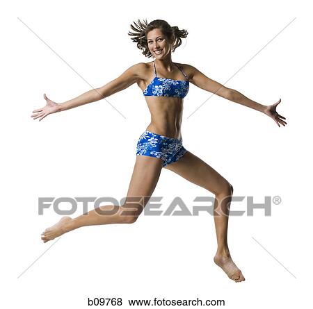 A young woman jumping View Large Photo Image Stock Photo - A young woman jumping. Fotosearch