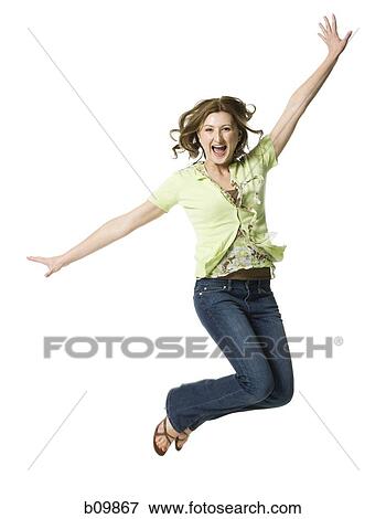 A young woman jumping View Large Photo Image Stock Photo - A young woman jumping. Fotosearch