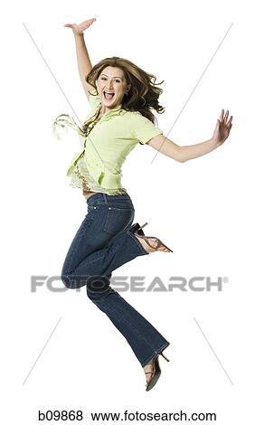 A young woman jumping View Large Photo Image Stock Photo - A young woman jumping. Fotosearch