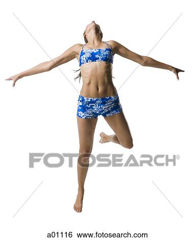 A young woman jumping View Large Photo Image Stock Photograph - A young woman jumping. Fotosearch