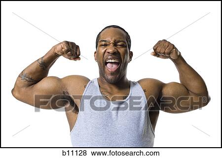 Stock Photo - African American man flexing arm muscles. Fotosearch
