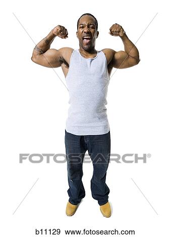 Stock Photo - African American man flexing arm muscles. Fotosearch
