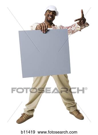 African American man holding a blank sign View Large Photo Image Stock Photo - African American man holding a blank sign. Fotosearch
