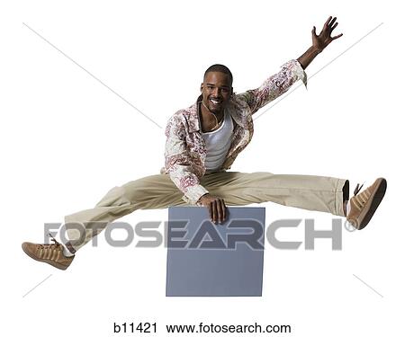 African American man jumping and holding a blank sign View Large Photo Image Stock Image - African American man jumping and holding a blank sign. Fotosearch