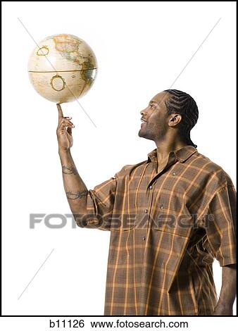 African American man spinning globe on finger View Large Photo Image Stock Photograph - African American man spinning globe on finger. Fotosearch