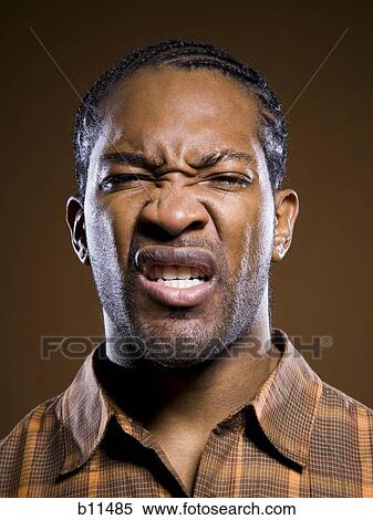 Stock Photography - African American scowling. Fotosearch