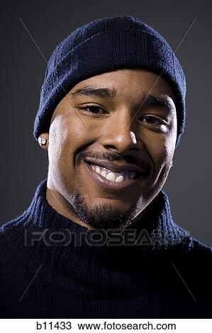 Stock Image - African American smiling man. Fotosearch