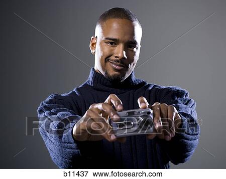 African American taking picture with digital camera View Large Photo Image Stock Photo - African American taking picture with digital camera. Fotosearch