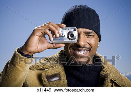 African American taking picture with digital camera View Large Photo Image Stock Photo - African American taking picture with digital camera. Fotosearch