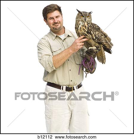 Animal handler with owl View Large Photo Image Stock Image - Animal handler with owl. Fotosearch