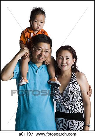 Asian parents with young boy View Large Photo Image Stock Photo - Asian parents with young boy. Fotosearch