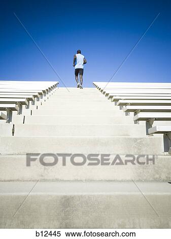 Athlete training and running up stairs View Large Photo Image Stock Photography - Athlete training and running up stairs. Fotosearch