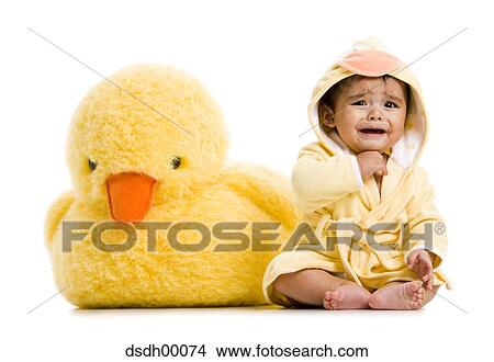Baby Boy in bathrobe with stuffed duck View Large Photo Image Picture - Baby Boy in bathrobe with stuffed duck. Fotosearch